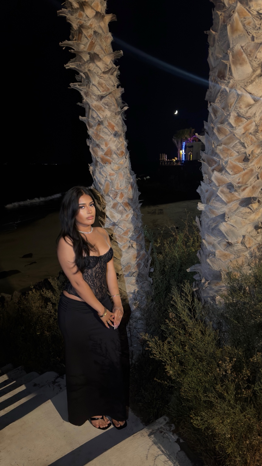 Mila by the sea at night